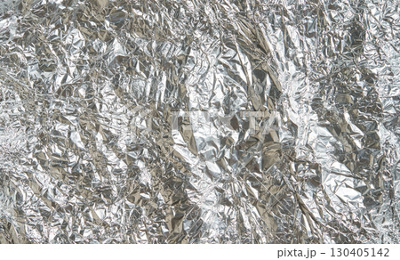 Crumpled aluminum foil texture with metallic surface and reflective patterns 130405142