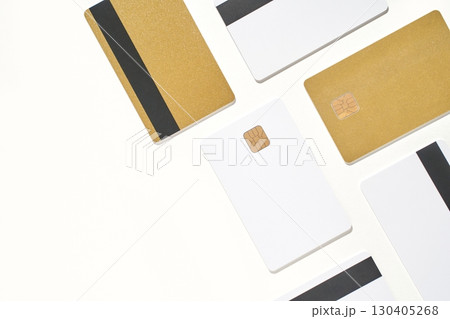 Arrangement of gold and white credit cards with chips and magnetic stripes Arrangement of gold and white credit cards with chips and magnetic stripes 130405268