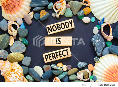 Nobody is perfect symbol. Concept words Nobody is perfect on beautiful block. Sea stones shells. Beautiful black background. Business motivational lifestyle and nobody is perfect concept. Copy space. Nobody is perfect symbol. Concept words Nobody is perfect on beautiful block. Sea stones shells. Beautiful black background. Business motivational lifestyle and nobody is perfect concept. Copy space. 130406338
