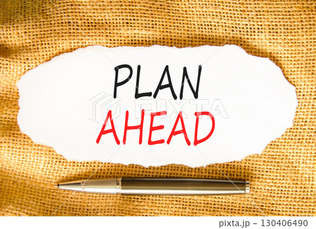 Plan ahead symbol. Concept word Plan ahead on beautiful white paper. Beautiful canvas background. Black pen. Business plan ahead concept. Copy space. Plan ahead symbol. Concept word Plan ahead on beautiful white paper. Beautiful canvas background. Black pen. Business plan ahead concept. Copy space. 130406490