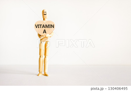 Vitamin A symbol. Concept words Vitamin A on beautiful wooden heart. Doctor's model. Beautiful white background. Copy space. Medical healthy lifestyle Vitamin A concept. Vitamin A symbol. Concept words Vitamin A on beautiful wooden heart. Doctor's model. Beautiful white background. Copy space. Medical healthy lifestyle Vitamin A concept. 130406495