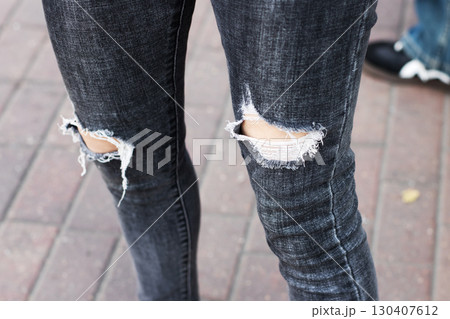 Trendy Distressed Black Jeans featuring Stylish Torn Knees Design Trendy Distressed Black Jeans featuring Stylish Torn Knees Design 130407612