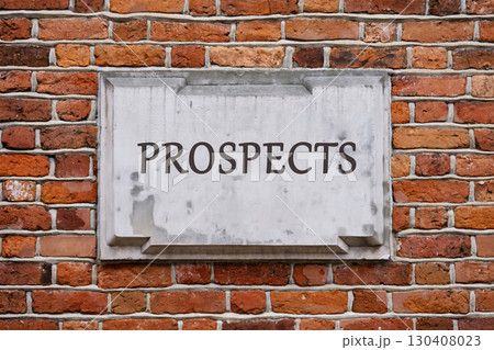 Lead Generation and converting them into Customers concept. Copy space. PROSPECTS written on a plaque on a weathered brick wall. 130408023