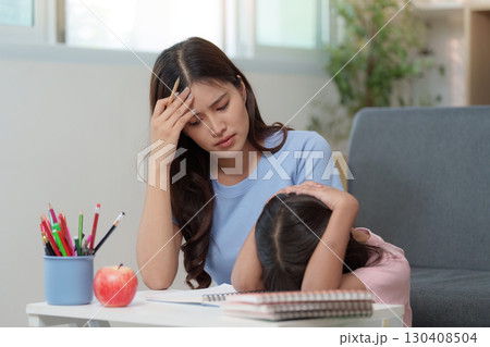 Mother helping child cope with school stress 130408504