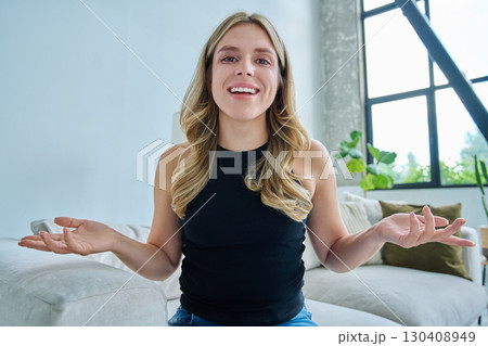 Web cam view of young woman talking looking in camera, online meeting, video call 130408949
