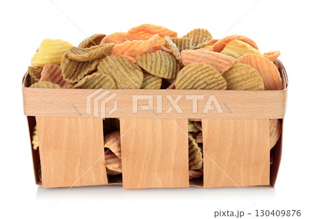 Assorted vegetable chips in thin plywood wooden tray for fruits, isolated on transparent background, full focus stacking with sharp detail and texture 130409876