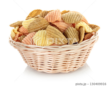 Woven small plate with vegetable chips, isolated on transparent background, full focus stacking for sharp texture and clear detail 130409916