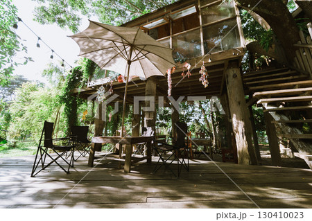 Local wooden house with tropical garden Local wooden house with tropical garden 130410023