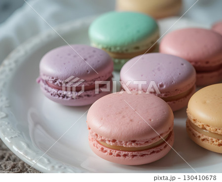 Assortment of colorful macarons, sweet meringue based confections made with almond flour, egg whites, and sugar. Assortment of colorful macarons, sweet meringue based confections made with almond flour, egg whites, and sugar. 130410678