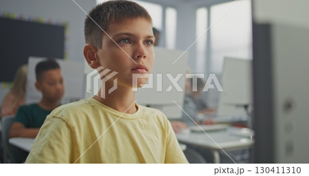 Young Boy Working on Creative Project on Computer, Practicing Digital Skills and Studying Programming Young Boy Working on Creative Project on Computer, Practicing Digital Skills and Studying Programming 130411310
