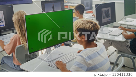 Primary School Boy Working on Creative Project on PC Monitor with Chroma Key During Digital Art Class Primary School Boy Working on Creative Project on PC Monitor with Chroma Key During Digital Art Class 130411336