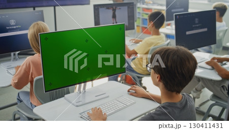 Primary School Boy Working on Creative Project on PC Monitor with Chroma Key During Digital Art Class Primary School Boy Working on Creative Project on PC Monitor with Chroma Key During Digital Art Class 130411431