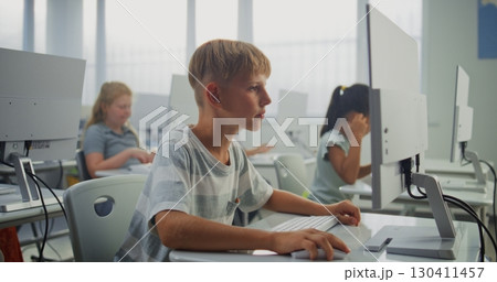 Smart Young Boy Using Computer, Doing 3D Design Project. Teacher Helping Elementary School Children 130411457
