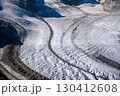 Pers Glacier in the Bernina Range captures the beauty of the Alps with its intricate ice formations and rugged mountain backdrop. 130412608