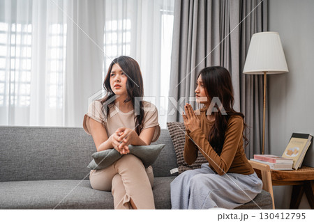 Two Women Engaged in a Deep and Meaningful Conversation on a Comfortable Sofa at Home Two Women Engaged in a Deep and Meaningful Conversation on a Comfortable Sofa at Home 130412795