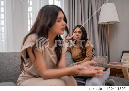 Two Women Engaged in a Deep and Meaningful Conversation While at Home Together Two Women Engaged in a Deep and Meaningful Conversation While at Home Together 130413295