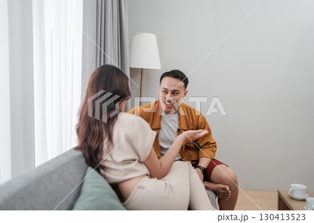 Engaging in Casual Conversation While Sitting in a Cozy Living Room Setting Engaging in Casual Conversation While Sitting in a Cozy Living Room Setting 130413523