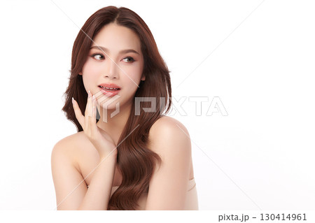 A beautiful young Asian woman with clean, fresh skin against a white background. Skincare, facial treatment, cosmetology, beauty, and spa. An elegant portrait of an Asian woman. A beautiful young Asian woman with clean, fresh skin against a white background. Skincare, facial treatment, cosmetology, beauty, and spa. An elegant portrait of an Asian woman. 130414961