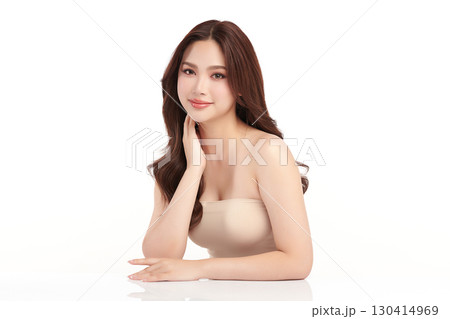 A beautiful young Asian woman with clean, fresh skin against a white background. Skincare, facial treatment, cosmetology, beauty, and spa. An elegant portrait of an Asian woman. A beautiful young Asian woman with clean, fresh skin against a white background. Skincare, facial treatment, cosmetology, beauty, and spa. An elegant portrait of an Asian woman. 130414969