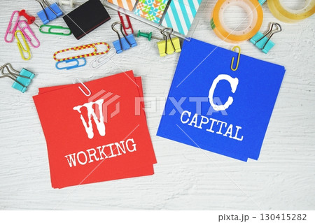 WC - Working Capital text on stick note with stationery on concrete background WC - Working Capital text on stick note with stationery on concrete background 130415282