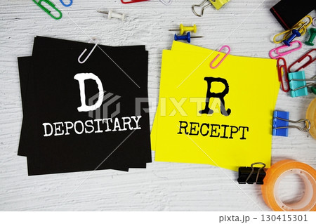 DR - Depositary Receipt text on stick note with stationery on concrete background DR - Depositary Receipt text on stick note with stationery on concrete background 130415301