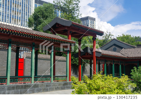 Chinese traditional architecture on a background of a modern skyscrapers Chinese traditional architecture on a background of a modern skyscrapers 130417235