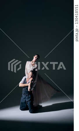 Ballet pair in dramatic stage light with emotional posture 130418551