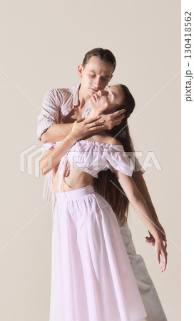 Dance partners in dynamic lift with emotional storytelling Dance partners in dynamic lift with emotional storytelling 130418562