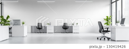 Bright, modern open space office featuring a row of computer desks, large panoramic windows offering city views, a big blank wall, and a clean white floor, creating a minimalist atmosphere 130419426