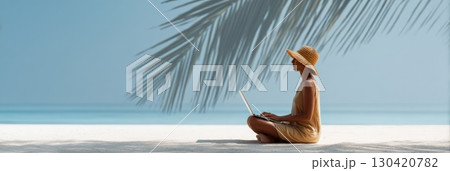 Woman wearing a straw hat using laptop while working remotely on a beautiful tropical beach under palm tree shadow, enjoying work and travel lifestyle Woman wearing a straw hat using laptop while working remotely on a beautiful tropical beach under palm tree shadow, enjoying work and travel lifestyle 130420782