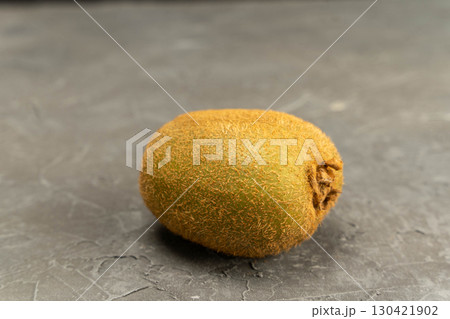 Fresh ripe kiwi fruit on plain grey background, healthy food 130421902