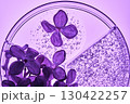 Three-piece petri dish with lilac flowers and whey texture. 130422257