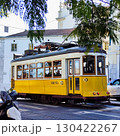 Yellow vintage tram from Carris is traveling through the streets of Lisbon, showcasing the city's iconic public transportation and vibrant atmosphere. Elevador da Gloria, Gloria funicular, Lisboa 130422267