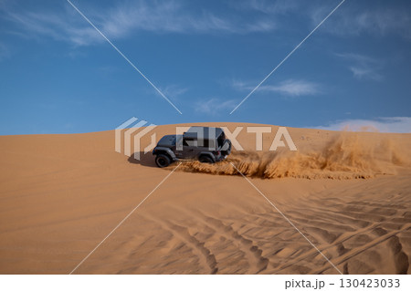 Jeep off-road driving on sand dunes, Saudi Arabia 130423033