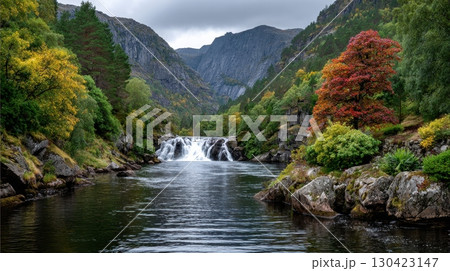 Waterfall in rugged landscape, vibrant fall foliage, and tranquil beauty. Captures essence of autumn colors and flowing river Waterfall in rugged landscape, vibrant fall foliage, and tranquil beauty. Captures essence of autumn colors and flowing river 130423147