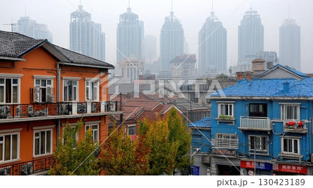 Shanghai's old residential buildings stand in stark contrast to the skyscrapers rising through the smog, capturing the city's evolving landscape 130423189