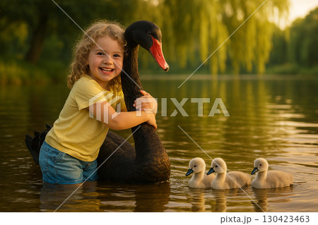 A Heartwarming Image of a Girl's Tender Hug with a Black Swan on the Water, Symbolizing a Deep Connection Between Humans and Nature. 130423463