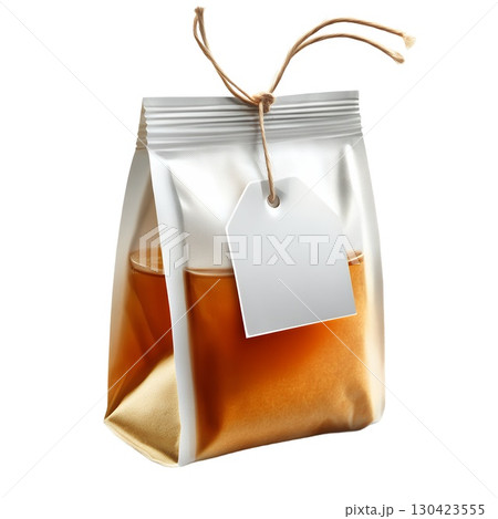 A transparent pouch filled with amber liquid, tied with twine and a blank tag, perfect for tea or other beverages 130423555
