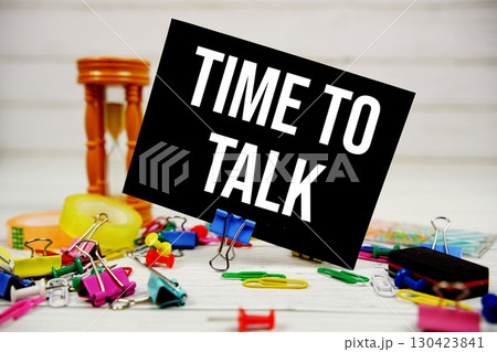 Time To Talk text on paper card with stationary on wooden background Time To Talk text on paper card with stationary on wooden background 130423841