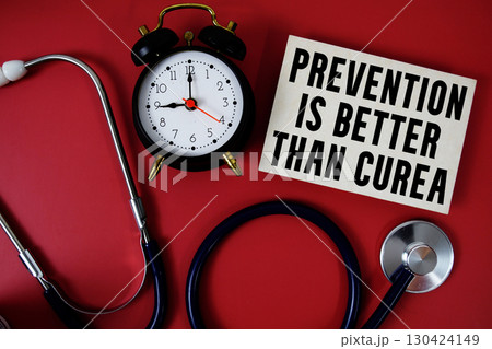 Prevention Is Better Than Cure text written on paper card with stethoscope and alarm clock on red background Prevention Is Better Than Cure text written on paper card with stethoscope and alarm clock on red background 130424149