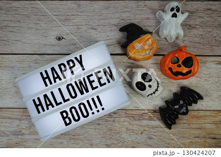 Happy Halloween text with element decorations on orange background Happy Halloween text with element decorations on orange background 130424207