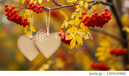 Blank tags for autumn promotions. A template for seasonal sales on a blurry background with rowan berries and leaves. 130424966