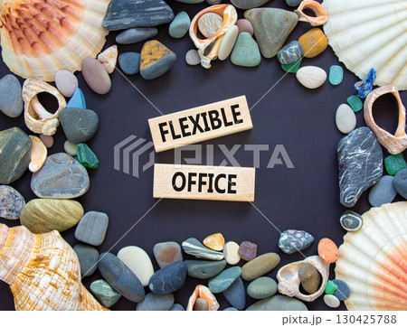 Flexible office symbol. Concept words Flexible office on beautiful wooden block. Sea shell and sea stone. Beautiful black paper background. Business Flexible office concept. Copy space. 130425788
