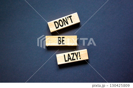 Motivational and do not be lazy symbol. Concept words Do not be lazy on wooden blocks on a beautiful black table black background. Business do not be lazy concept. Copy space. Motivational and do not be lazy symbol. Concept words Do not be lazy on wooden blocks on a beautiful black table black background. Business do not be lazy concept. Copy space. 130425809
