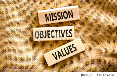 Mission objectives values symbol. Concept words Mission Objectives Values on beautiful blocks. Beautiful canvas table canvas background. Business mission objectives values concept. Copy space. Mission objectives values symbol. Concept words Mission Objectives Values on beautiful blocks. Beautiful canvas table canvas background. Business mission objectives values concept. Copy space. 130425818