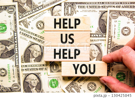 Help you symbol. Concept words phrase Help us help you on beautiful wooden blocks. Dollar bills. Businessman's hand. Beautiful dollar bills background. Business Help you concept. Copy space. 130425845