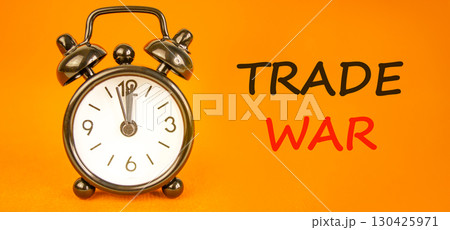 Trade war symbol. Concept word Trade war on beautiful orange paper. Beautiful black alarm clock. Beautiful orange paper background. Business trade war concept. Copy space. Trade war symbol. Concept word Trade war on beautiful orange paper. Beautiful black alarm clock. Beautiful orange paper background. Business trade war concept. Copy space. 130425971