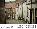 Narrow street winding its way down in Staithes Yorkshire 130426884