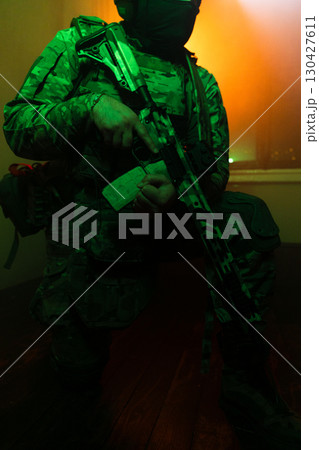 Tactical Soldier in Action Helmet On Off Dramatic Lights Smoke 130427611