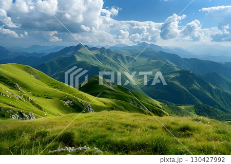 Sunny Mountain Range with Verdant Summer Hills 130427992